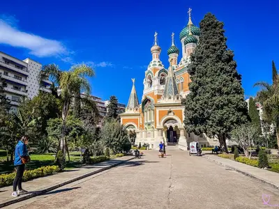 a church in a city with people standing in front of it at Spacious Family Apartment Near Sea - Nice in Nice