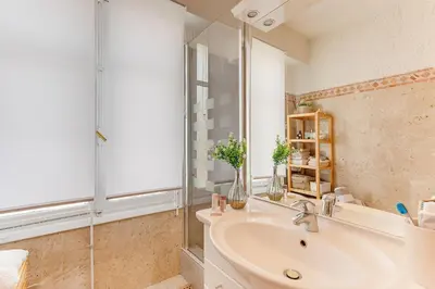 a bathroom with a sink and a glass shower at LE LAFAYETTE 2 AP4474 by Riviera Holiday Homes in Nice