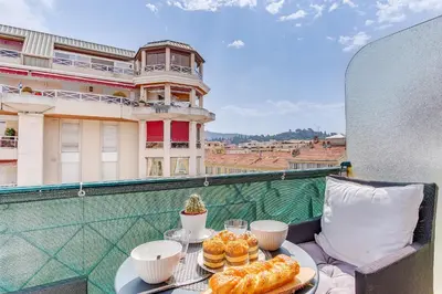 a tray of pastries on a table on a balcony at LE LAFAYETTE 2 AP4474 by Riviera Holiday Homes in Nice