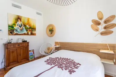 a bedroom with a bed and a painting on the wall at LE LAFAYETTE AP4410 By Riviera Holiday Homes in Nice