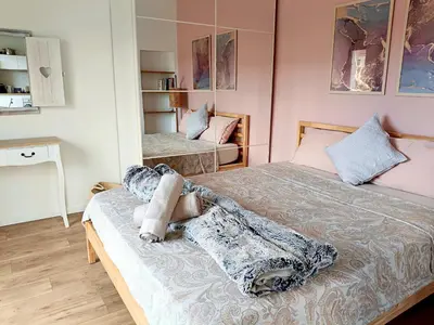 two beds in a room with pink walls at Stunning 2 bedroom apartment with Terrace and Sea view, Nice Cimiez Liberation in Nice