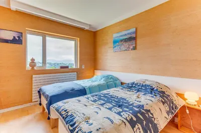 a bedroom with two beds and a window at VILLA DYONIS VI4439 by Riviera Holiday Homes in Nice