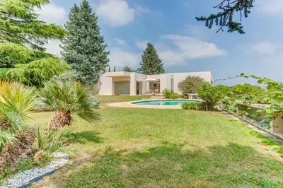 a villa with a swimming pool in a yard at VILLA DYONIS VI4439 by Riviera Holiday Homes in Nice
