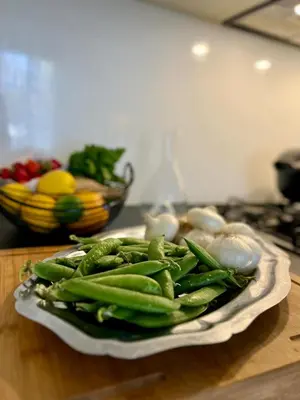 a plate of green vegetables sitting on a table at Bel appartement 2 pièces à Nice in Nice