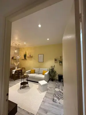 a living room with a couch and a table at Nice Jussieu 2 pièces entièrement rénové in Nice