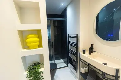 a bathroom with a sink and a shower at Central- walk to Massena & Beach in Nice