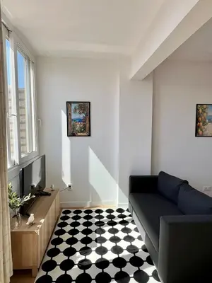 a living room with a black and white checkered floor at TheNiceTerrace in Nice