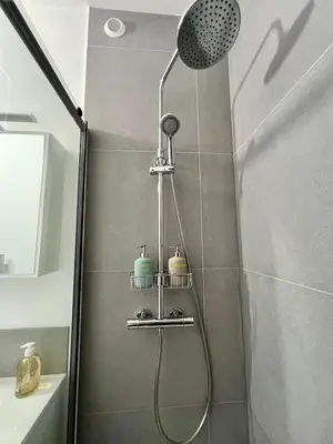 a shower with a shower head in a bathroom at TheNiceTerrace in Nice