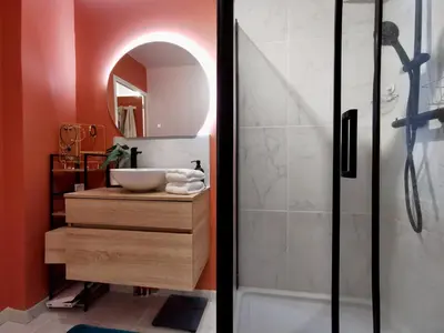 a bathroom with a sink and a shower at Cosy Savoie by Bookking Guys in Nice