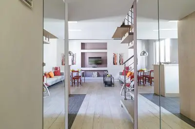 a living room and dining room with sliding glass doors at MY CASA - FRANCE 82 - 2 rooms -1 min from the Sea - Parking in Nice