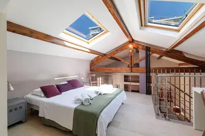 a bedroom with a bed in a room with windows at MY CASA - FRANCE 82 - 2 rooms -1 min from the Sea - Parking in Nice