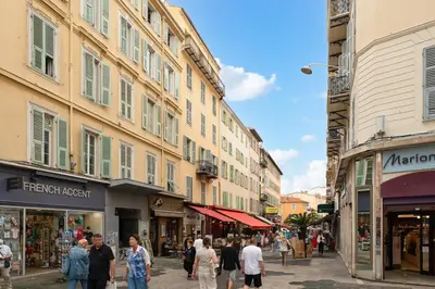 a group of people walking down a street with buildings at Nice Renting - 35b MASSENA - Chic Cosy Calm Balcony Massena Pedestrian Heart in Nice