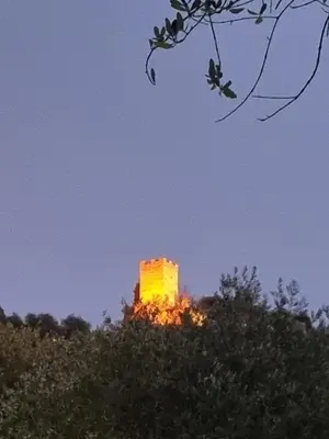 a building on top of a hill with flames at Le Jas in Tourrette-Levens