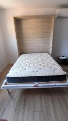 a mattress on a bed frame in a room at Studio La Madrague Côte d'Azur in Cros-de-Cagnes