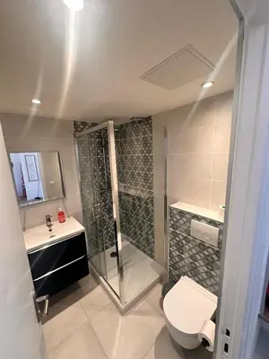 a bathroom with a shower and a toilet and a sink at Studio Smile FSHH in Nice