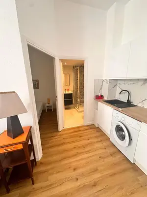 a kitchen with a washing machine and a sink at Studio Smile FSHH in Nice