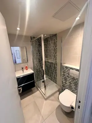 a bathroom with a shower and a toilet and a sink at Studio Smile FSHH in Nice
