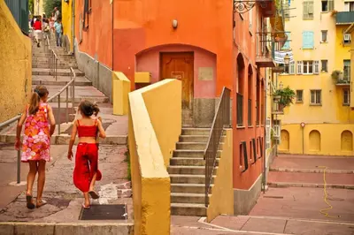 two women walking down a street with stairs at MY CASA - CASSINI - Garibaldi Square - AC in Nice