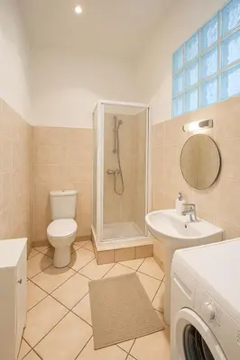 a bathroom with a toilet and a shower and a sink at Charming & roomy apartment with balcony heart of Nice in Nice