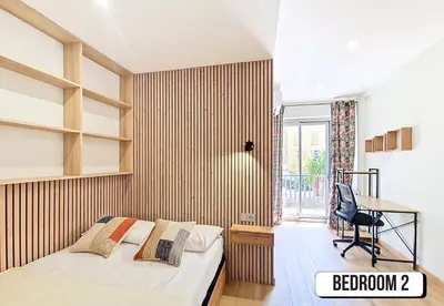 a bedroom with a bed and a desk and a chair at Nestor&Jeeves - MAYA TERRASSE - Centre ville in Nice