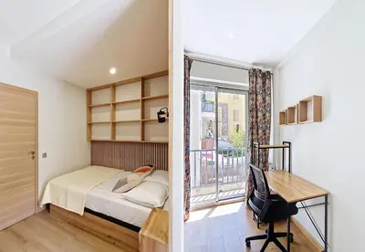a bedroom with a bed and a desk and a window at Nestor&Jeeves - MAYA TERRASSE - Centre ville in Nice
