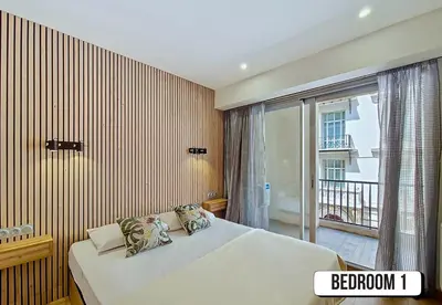 a bedroom with a bed and a large window at Nestor&Jeeves - MAYA TERRASSE - Centre ville in Nice