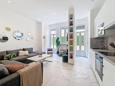 a living room with a couch and a table at Nestor&Jeeves - OASIS - Terrace in the city in Nice