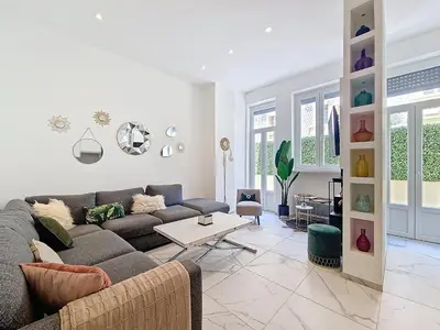 a living room with a couch and a table at Nestor&Jeeves - OASIS - Terrace in the city in Nice