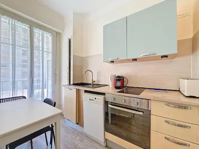 a kitchen with a sink and a stove top oven at Nestor&Jeeves - ESPRIT SUD - Near Promenade des Anglais in Nice