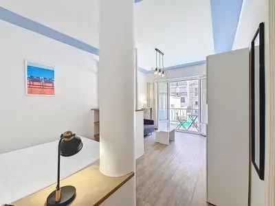 a living room with white walls and a floor to ceiling window at Nestor&Jeeves - ESPRIT SUD - Near Promenade des Anglais in Nice