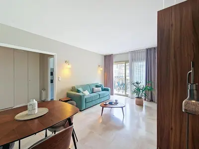a living room with a couch and a table at Nestor&Jeeves - VICTORIA - Delux apartment city center in Nice