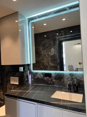 a bathroom with a sink and a mirror at Grand Studio Luxe in Nice