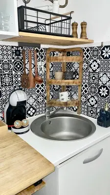 a kitchen with a counter top and a microwave at Studio in the center balcony AC in Nice