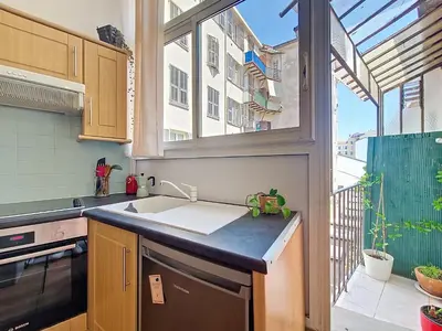 a kitchen with a sink and a window at Nestor&Jeeves - PALAIS DE LA SIRENE - Near Promenade des Anglais in Nice
