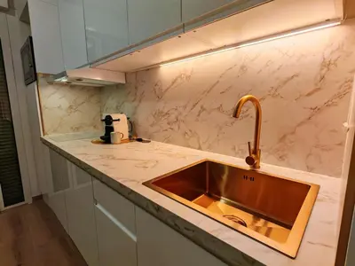 a kitchen with a sink and a counter top at SEA SIDE - Rooftop Pool SeaView in Saint-Laurent-du-Var