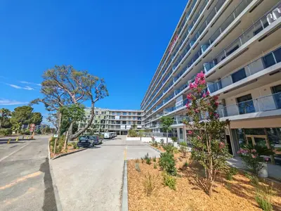an empty street in front of an apartment building at SEA SIDE - Rooftop Pool SeaView in Saint-Laurent-du-Var