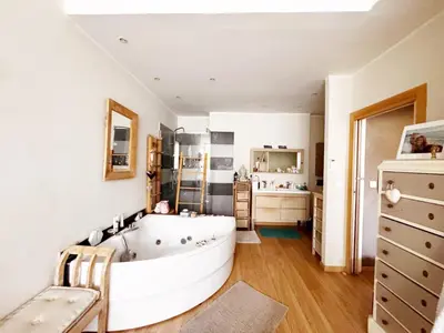 a large white bathroom with a tub and a sink at Blue dream and zen Holidays in Nice