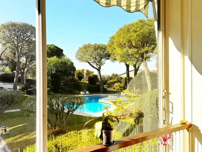 a window with a view of a swimming pool at Blue dream and zen Holidays in Nice