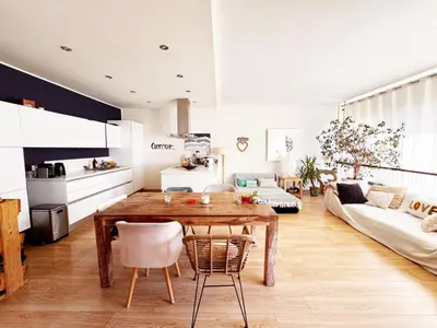 a kitchen and living room with a wooden table at Blue dream and zen Holidays in Nice