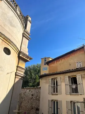 a building with a clock tower next to a building at Studio calme & climatisé - Quartier du Vieux-Nice animé proche plages & restos in Nice