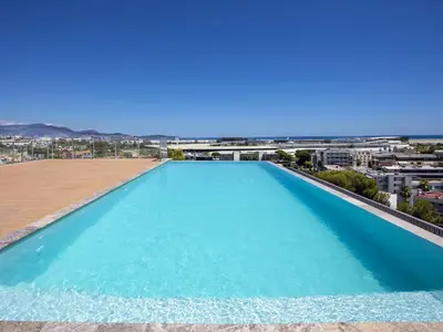 a large swimming pool on the roof of a building at Chez Valentina et Alexandre Port et plages à pied in Saint-Laurent-du-Var