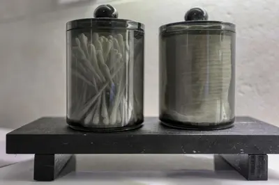 two metal containers sitting on a black shelf at Chez Valentina et Alexandre Port et plages à pied in Saint-Laurent-du-Var
