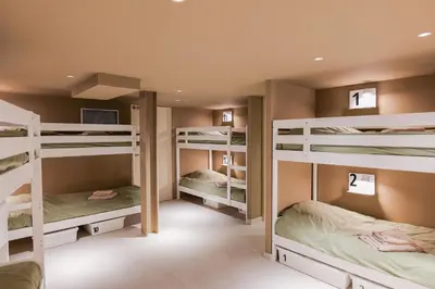 a room with four bunk beds with a computer on it at Extra Spacious Modern Apartment HUB Nice Center in Nice