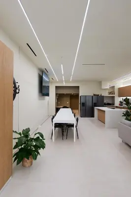 a dining room with a table and a kitchen at Extra Spacious Modern Apartment HUB Nice Center in Nice