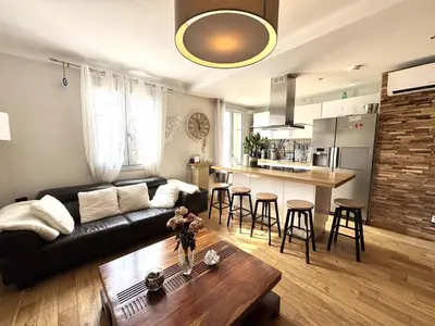 a living room with a couch and a table at BB OT Petit Balcon De La Providence - Old Town in Nice