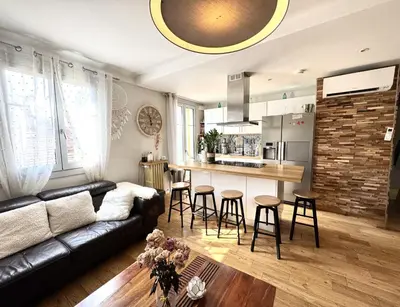 a living room with a couch and a kitchen at BB OT Petit Balcon De La Providence - Old Town in Nice