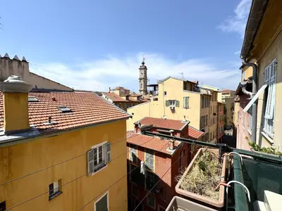 a view of a city with a clock tower in the distance at BB OT Petit Balcon De La Providence - Old Town in Nice