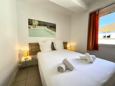 a bedroom with a bed and a swimming pool at C OT Maison de la Place - Old Town in Nice