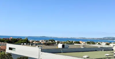 a view from the roof of a building with a tennis court at 3 Pieces st laurent du Var in Saint-Laurent-du-Var