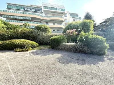 a building with a lot of bushes in front of it at 3 Pieces st laurent du Var in Saint-Laurent-du-Var